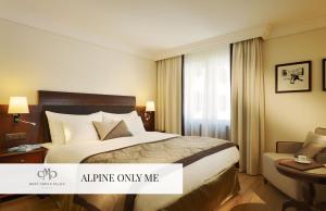 A bed or beds in a room at Mont Cervin Palace