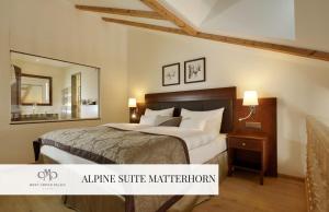 A bed or beds in a room at Mont Cervin Palace