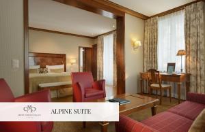 A bed or beds in a room at Mont Cervin Palace