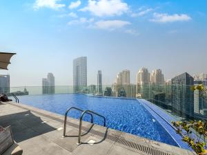 a large swimming pool on top of a building at Luxurious Studio Marina View Condor Marina Star in Dubai