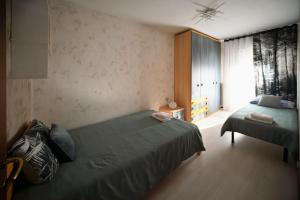 Postel nebo postele na pokoji v ubytování Angel Home