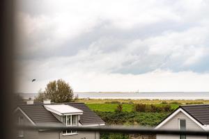 a view of the ocean from a house at Seaside 49 3 N in Wangerland