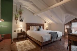Postel nebo postele na pokoji v ubytování Antigua Casona San Blas