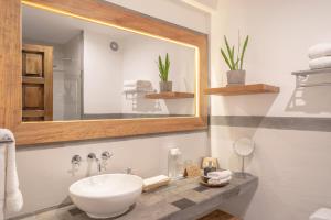 a bathroom with a sink and a mirror at Antigua Casona San Blas in Cusco +37 photos