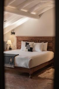 Postel nebo postele na pokoji v ubytování Antigua Casona San Blas