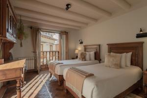 Postel nebo postele na pokoji v ubytování Antigua Casona San Blas