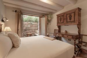 Postel nebo postele na pokoji v ubytování Antigua Casona San Blas