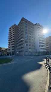 a large apartment building with a street in front of it at AR ALBELLI HOUSE in Košice