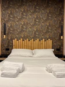 Eterna Suites Roma客房内的一张或多张床位