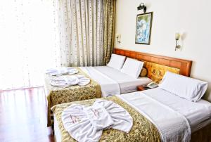 Postel nebo postele na pokoji v ubytování Santa Ottoman Hotel