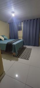 En eller flere senge i et værelse på Lar da praia