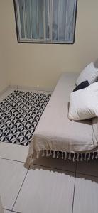 En eller flere senge i et værelse på Lar da praia