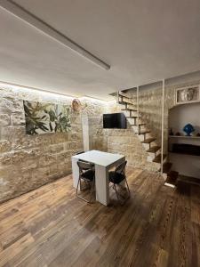 TV a/nebo společenská místnost v ubytování Quarata Apartment Corato mini appartamento