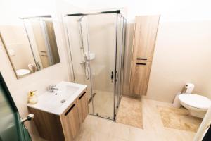 Koupelna v ubytování Gotha Aparthotel + 12 fotografií