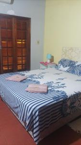 Una cama o camas en una habitación de Villa Morra house III