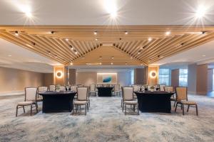 a banquet hall with tables and chairs in a room at San Juan Marriott Resort and Stellaris Casino in San Juan +37 photos