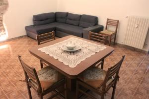 a living room with a table and a couch at MAISON 30 in Induno Olona