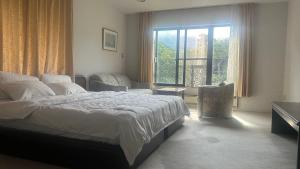Ένα ή περισσότερα κρεβάτια σε δωμάτιο στο Hakone Fairy Hotel
