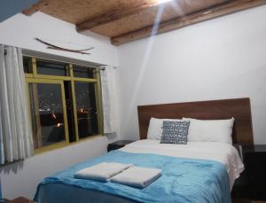 Postel nebo postele na pokoji v ubytování Carli's House San Blas