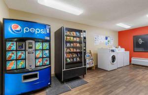 a grocery store with a pepsi refrigerator and a washer at Extended Stay America Suites - Corpus Christi - Staples in Corpus Christi