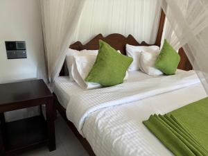 Postel nebo postele na pokoji v ubytování Brinkhouse Guesthouse , Unawatuna beach