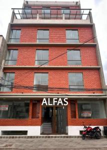 a red brick building with aidas sign on it at C 1 - Cálido depto Edif Alfas cambio paralelo in Tarija