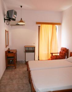 Säng eller sängar i ett rum på Andavis Hotel