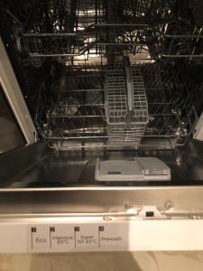 an open oven with a dish rack in it at Premium City Center 2 rooms Apartment Glassed Balcony FREE PRIVATE PARKING in Kemi +27 photos