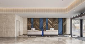 Ein Sitzbereich in der Unterkunft Holiday Inn Express Zhengzhou Nongye Road by IHG