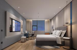 Ein Sitzbereich in der Unterkunft Holiday Inn Express Zhengzhou Nongye Road by IHG