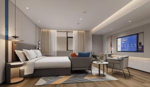 Ein Sitzbereich in der Unterkunft Holiday Inn Express Zhengzhou Nongye Road by IHG