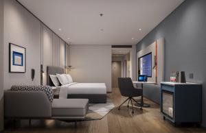 Ein Sitzbereich in der Unterkunft Holiday Inn Express Zhengzhou Nongye Road by IHG