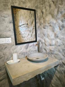 a bathroom sink with a mirror on a table at Ashok villa in Weligama +72 photos