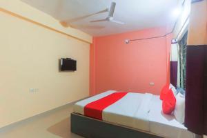 Postel nebo postele na pokoji v ubytování Hotel O Avigna Residency