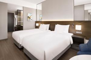 Postelja oz. postelje v sobi nastanitve Four Points by Sheraton Suwon