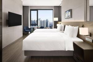 Postelja oz. postelje v sobi nastanitve Four Points by Sheraton Suwon