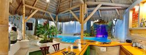 a room with a swimming pool in a house at MANTEÑA BOUTIQUE HOTEL in Puerto López