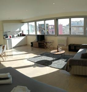 a living room with a couch and a table at Athens Experience 1 in Athens