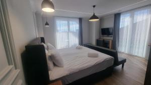 Postel nebo postele na pokoji v ubytování Hotel Luciano