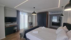 Postel nebo postele na pokoji v ubytování Hotel Luciano