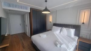 Postel nebo postele na pokoji v ubytování Hotel Luciano