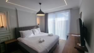 TV a/nebo společenská místnost v ubytování Hotel Luciano