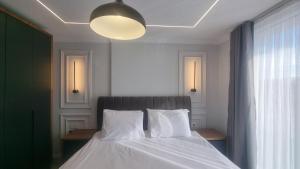 Postel nebo postele na pokoji v ubytování Hotel Luciano