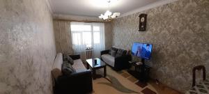 TV o dispositivi per l'intrattenimento presso Guest house with local family