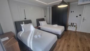 Postel nebo postele na pokoji v ubytování Hotel Luciano