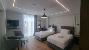 Postel nebo postele na pokoji v ubytování Hotel Luciano + 37 fotografií