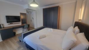 Postel nebo postele na pokoji v ubytování Hotel Luciano