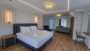 Postel nebo postele na pokoji v ubytování Hotel Luciano