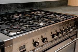 a stove top with a bunch of burners on it at HARU Residence, 5bed Luxury House in London