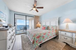 a bedroom with a bed and a ceiling fan at Bluewater Vacation Rentals in Orange Beach